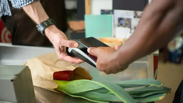 Person paying with smartphone at checkout — buy now pay later credit score impact