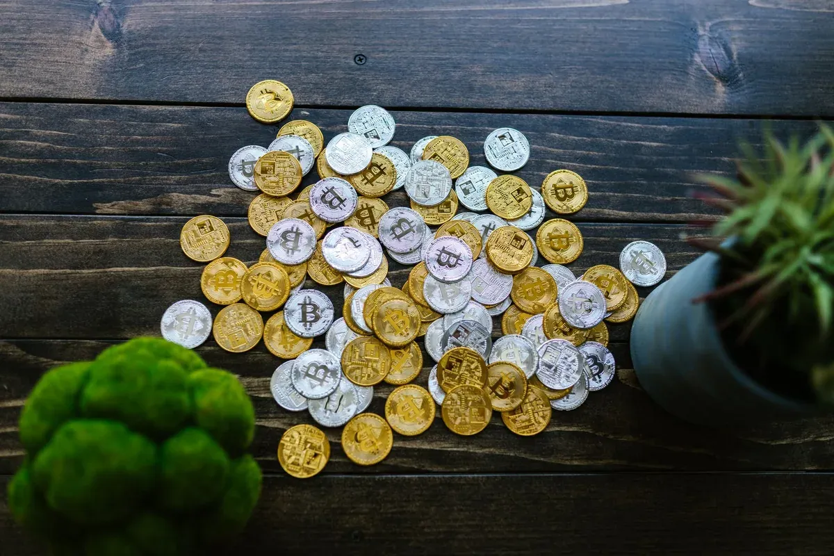 Stacks of coins on a wooden surface representing steady, compounding retirement growth toward a Coast FIRE number
