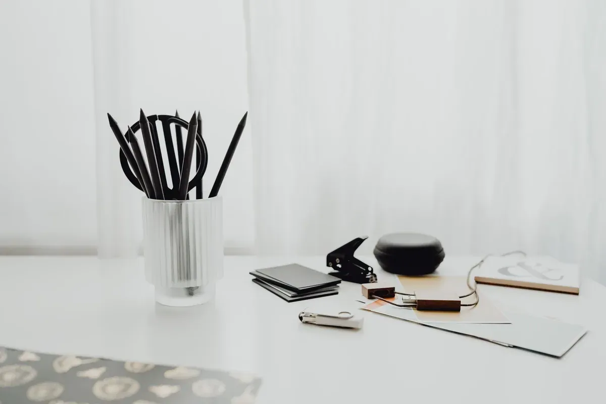 A clean, organized desk with pens, notebooks, and study supplies