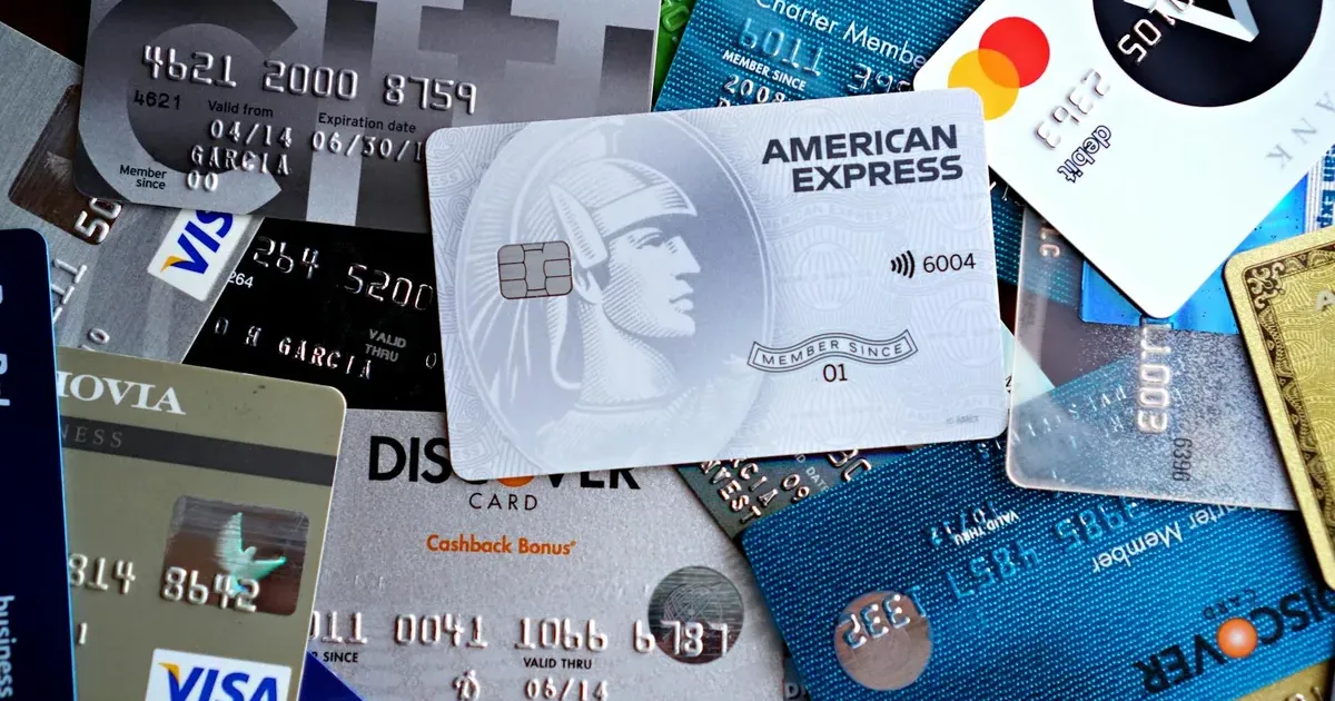 A spread of credit and debit cards representing America's average credit card debt in 2026