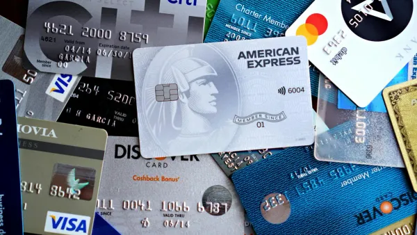 A spread of credit and debit cards representing America's average credit card debt in 2026