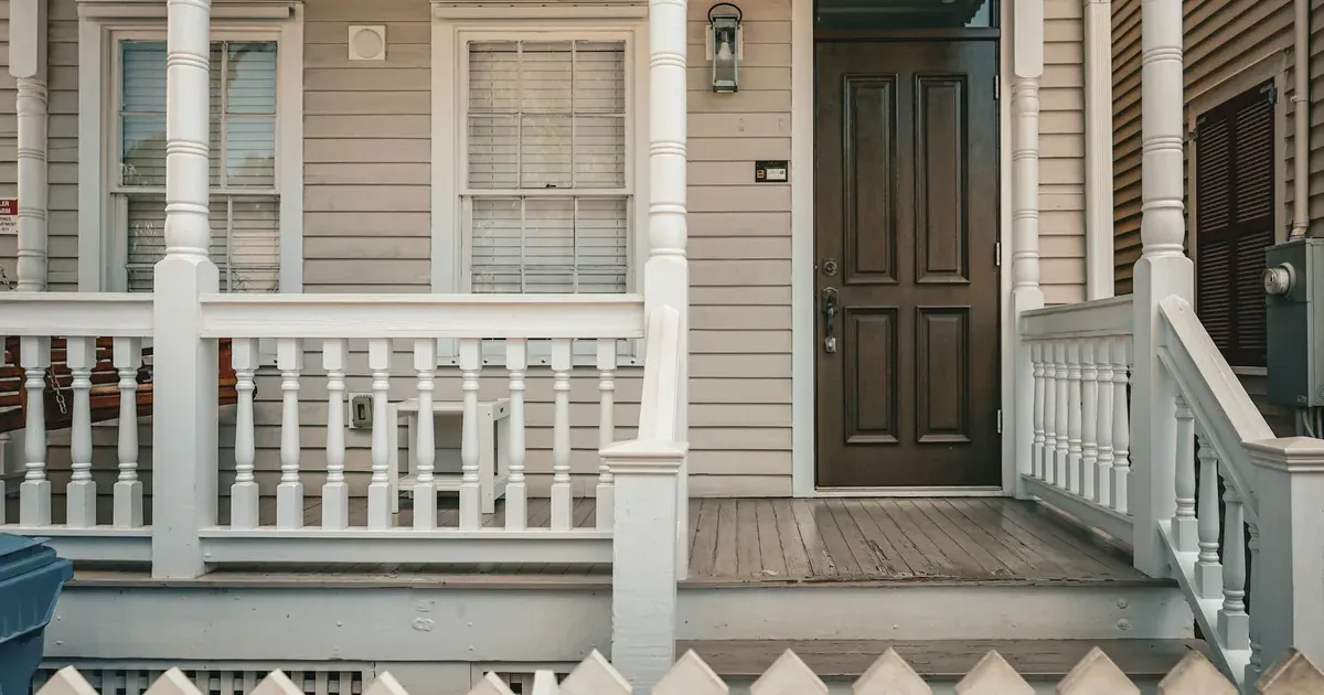 Suburban house porch — saving for a down payment in 2026 when mortgage rates are above 6%