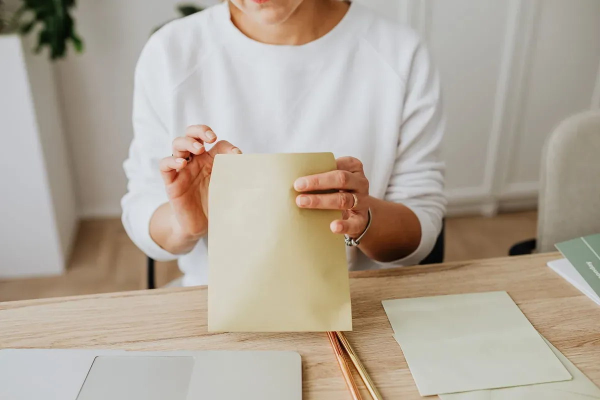 Reviewing statements and envelopes at home to audit variable-rate debt after a Fed rate hike