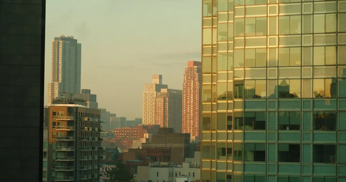 City skyline at dawn representing the Fed rate hike and what to do with debt