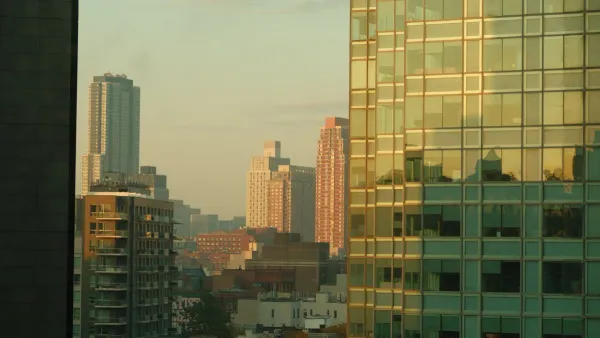 City skyline at dawn representing the Fed rate hike and what to do with debt