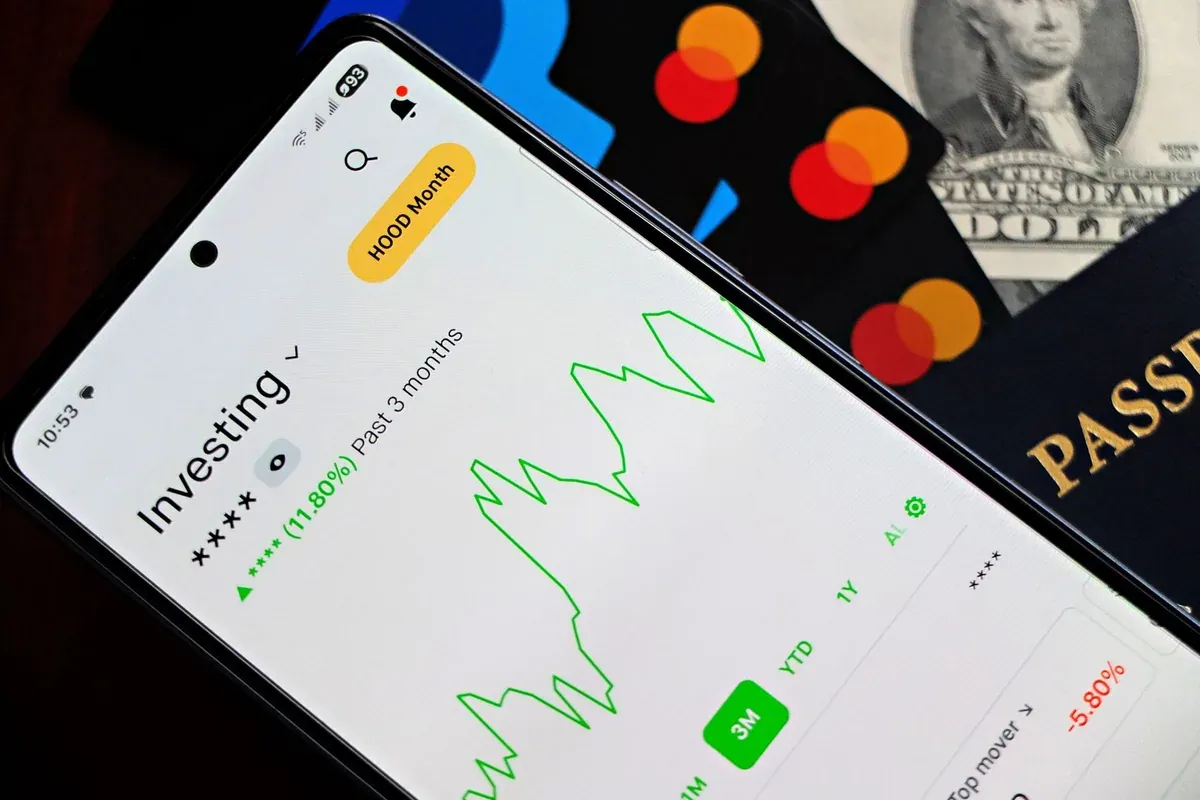Person tracking first job budget on a smartphone investment app