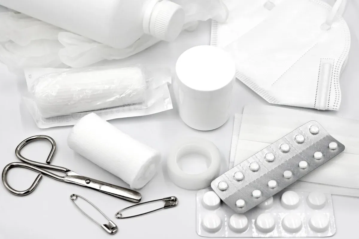 A first aid kit with organized medical supplies, representing planning HSA and FSA spending categories