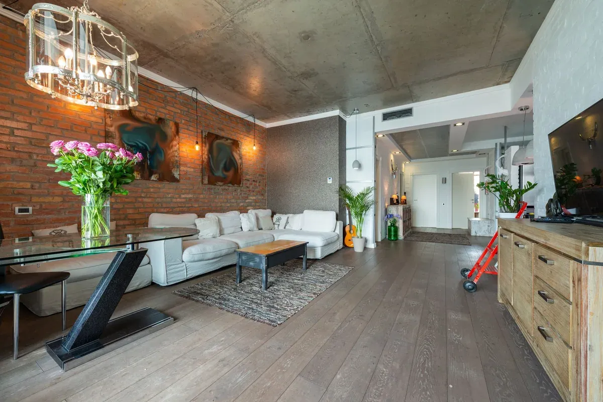 Modern loft apartment interior with natural light — urban rental housing 2026