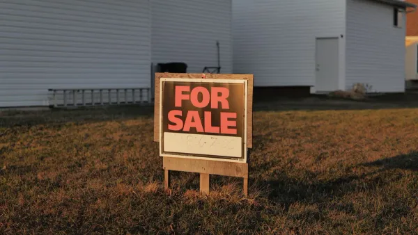 For sale sign in front of a suburban American house — rent vs buy 2026