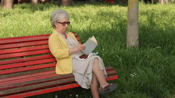 Person relaxing outdoors on a park bench, representing the soft saving lifestyle and work-life balance