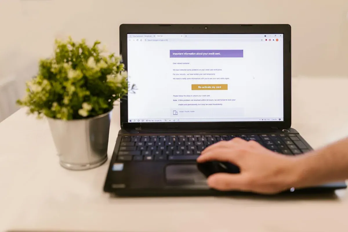 Laptop and credit card used to review and manage streaming subscription costs
