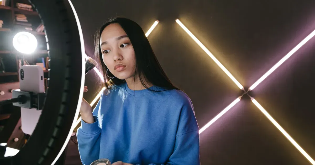 Creator filming a video at home, illustrating TikTok money advice and viral finance trends