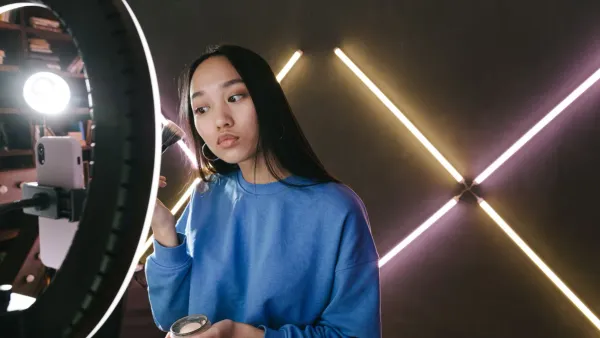 Creator filming a video at home, illustrating TikTok money advice and viral finance trends